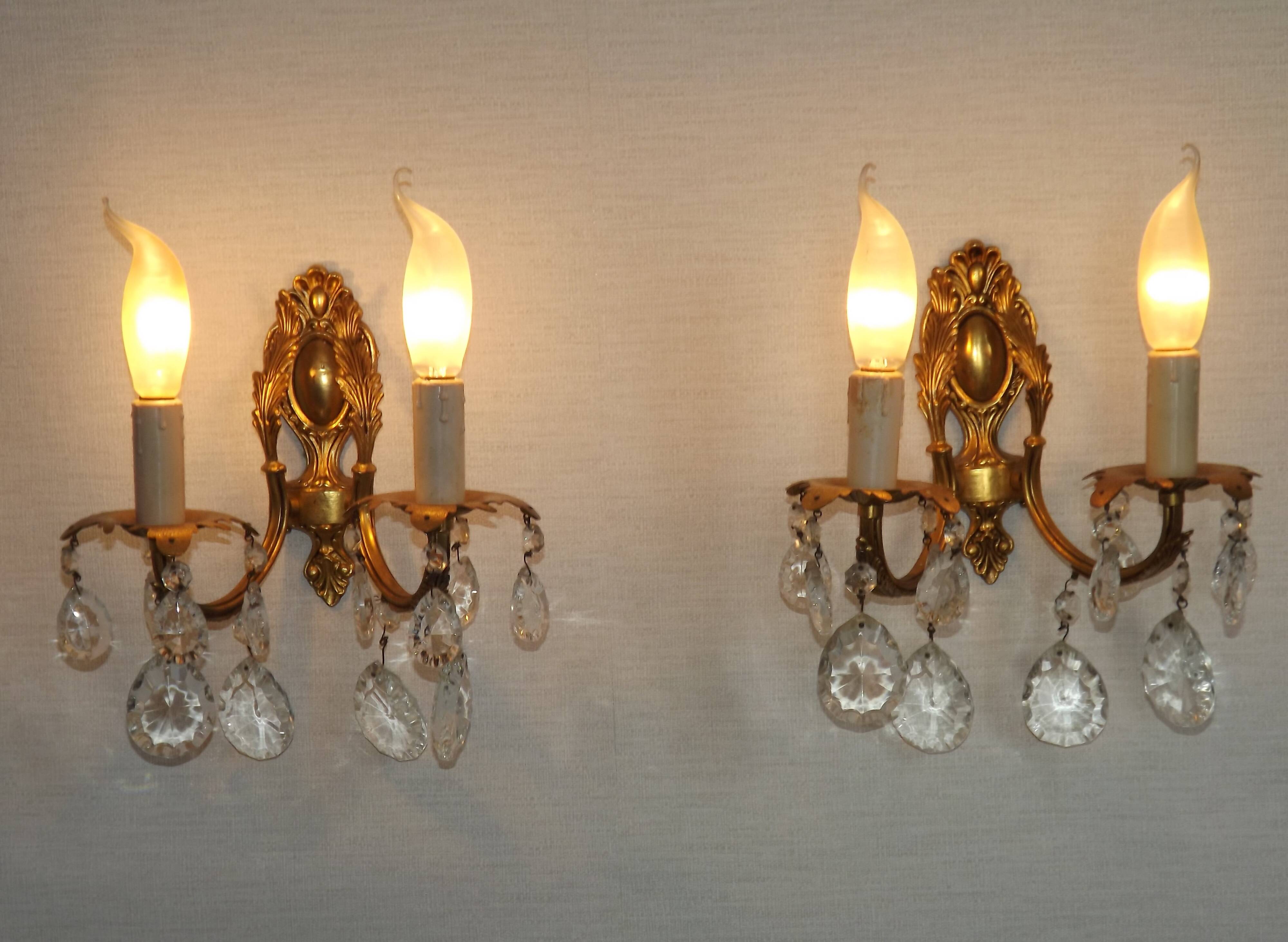 Pair of antique 2-light wall sconces in bronze with crystal pendants, Spain.