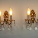 Pair of antique 2-light wall sconces in bronze with crystal pendants, Spain.