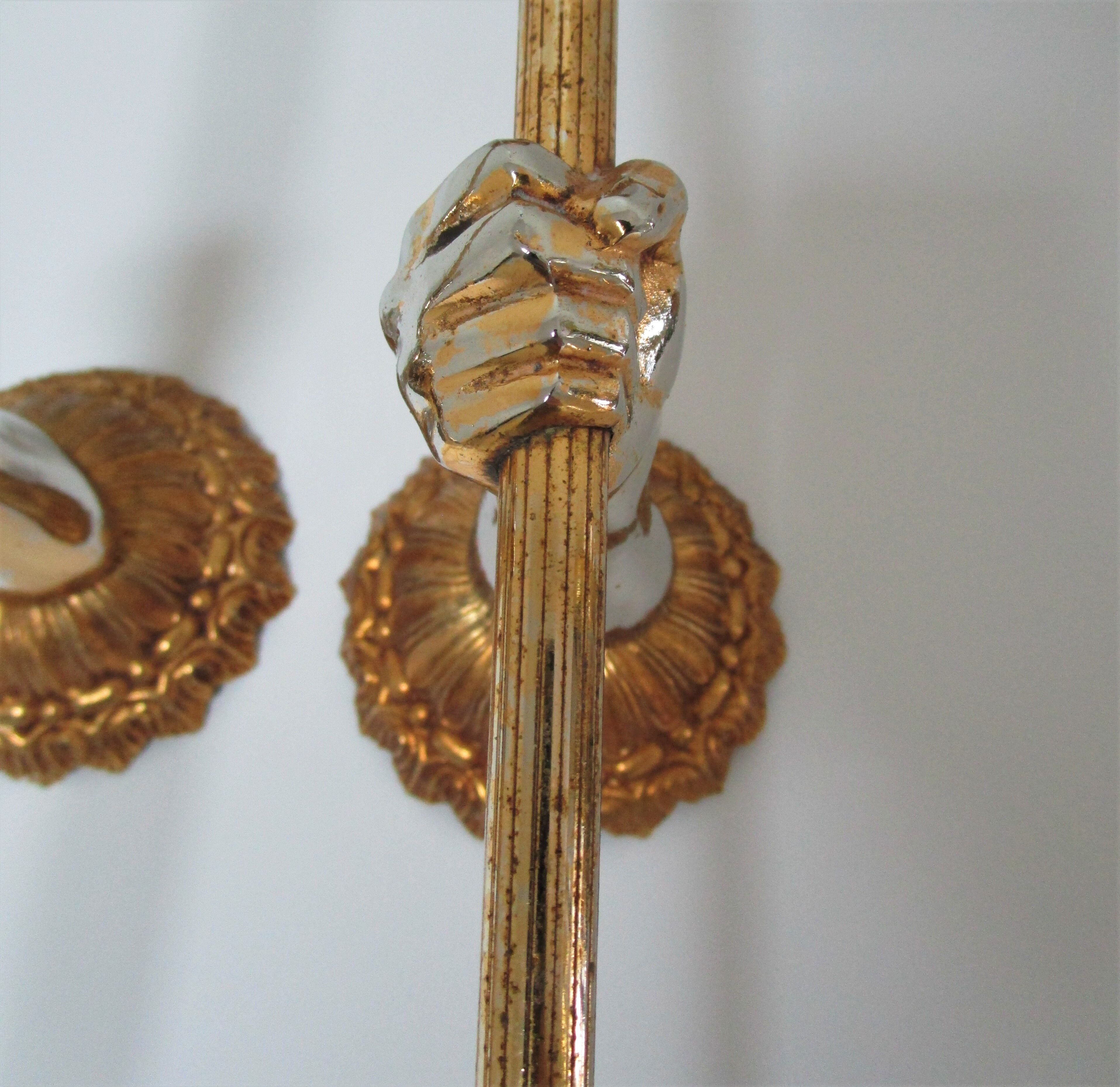Pair of vintage patinated golden metal hand sconces