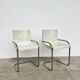 Pair of white moulded shell chairs with chrome tube — Space Age 70s
