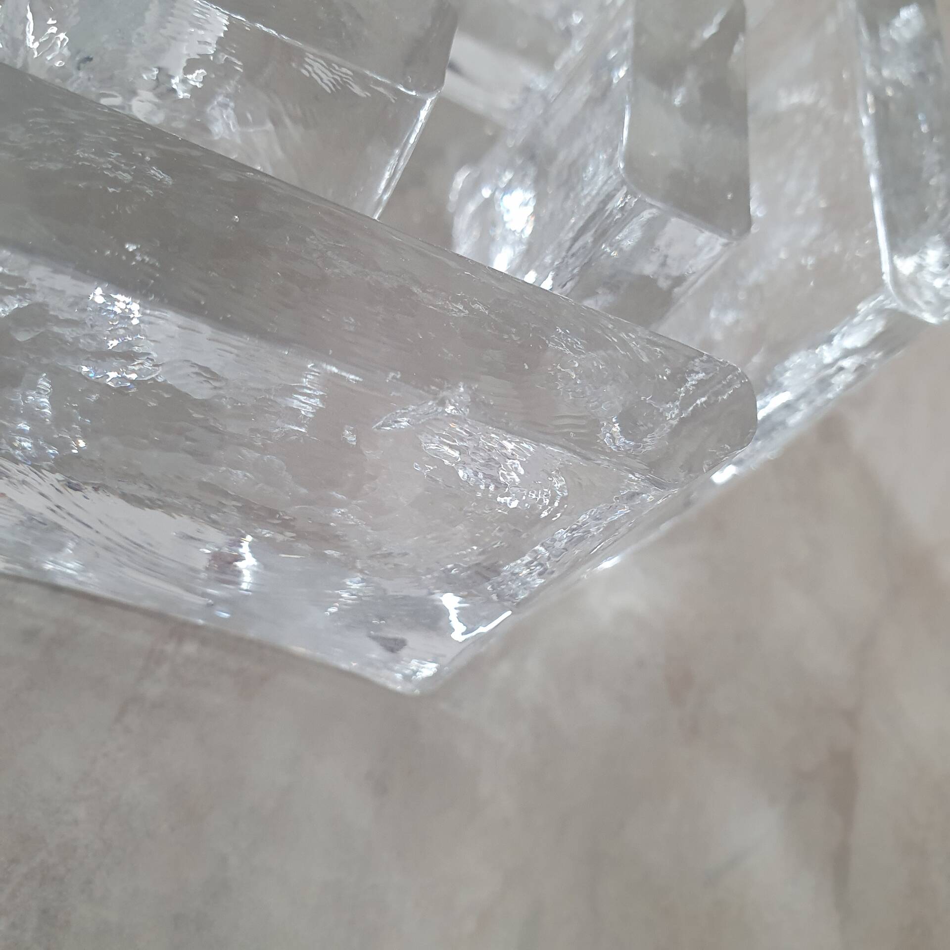 Candle holder or glass warmer with irregular ice effect.