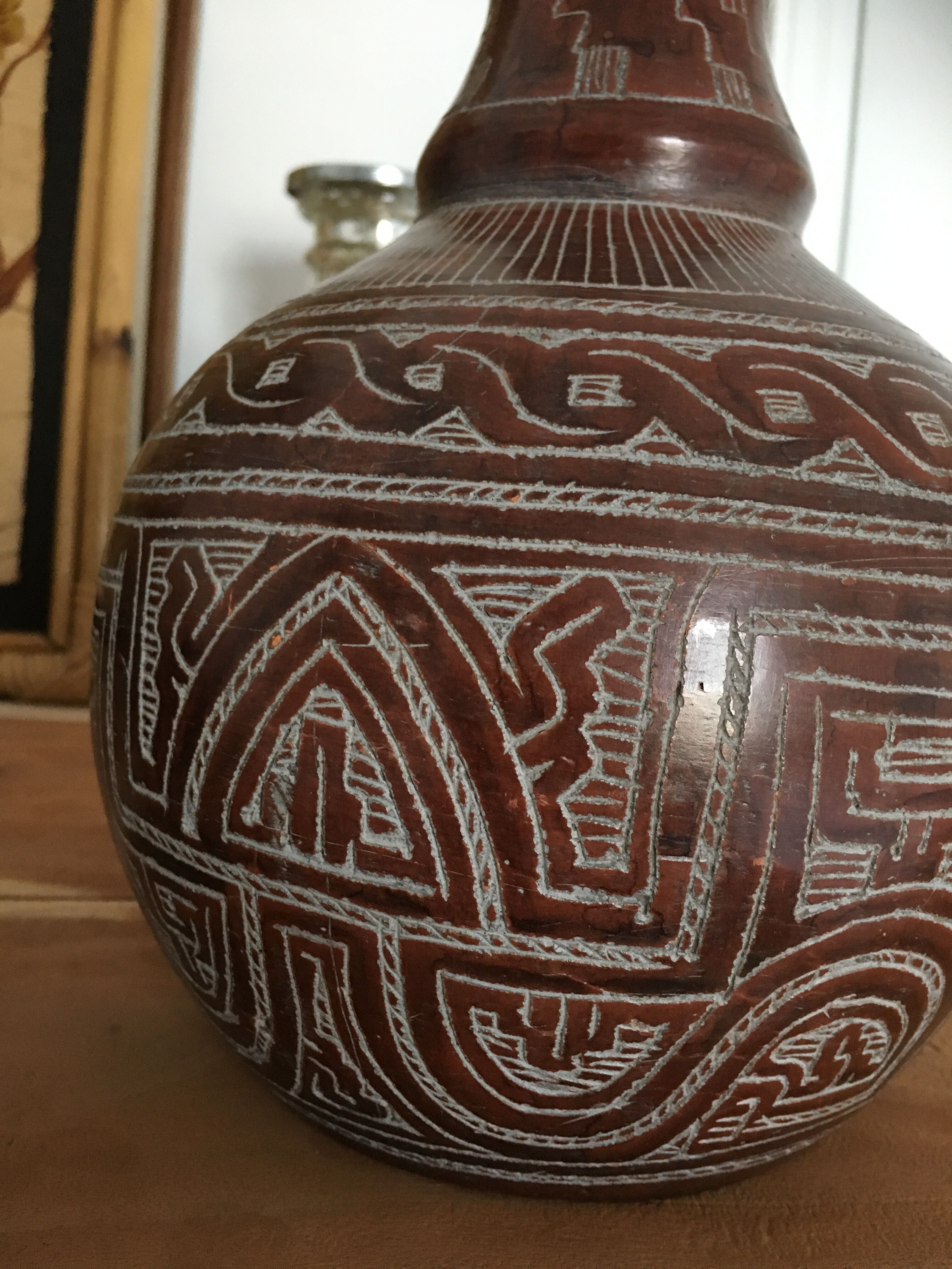 Vase in earth baked ethnic graphic patterns