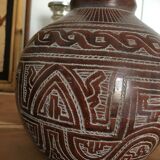 Vase in earth baked ethnic graphic patterns