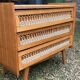 Rattan chest of drawers with tapered legs