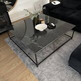 Coffee table with ceramic top and wrought iron base
