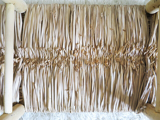 Wooden bench and straw