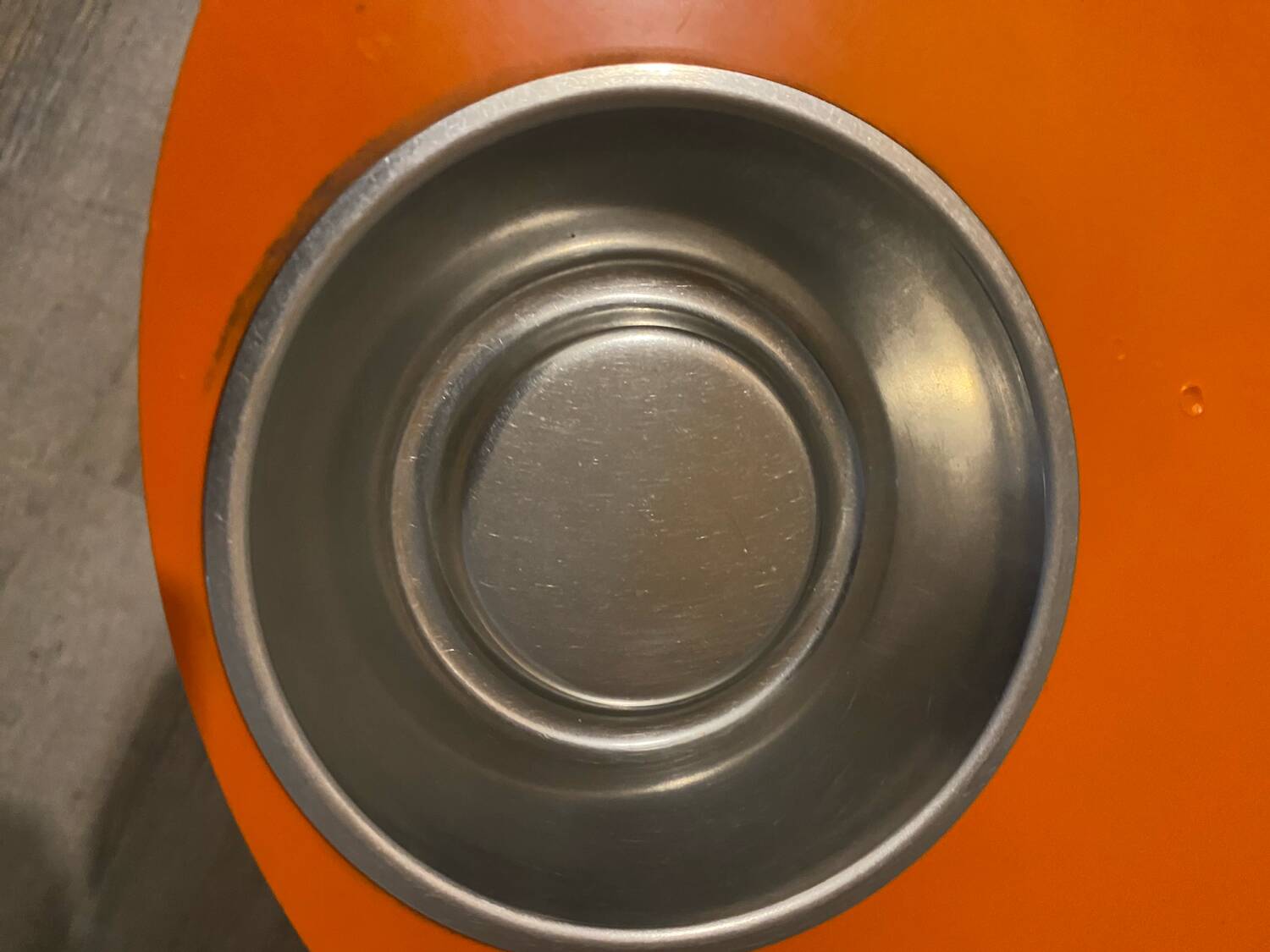 Orange tam-tam by Stamp with integrated pocket.