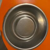 Orange tam-tam by Stamp with integrated pocket.