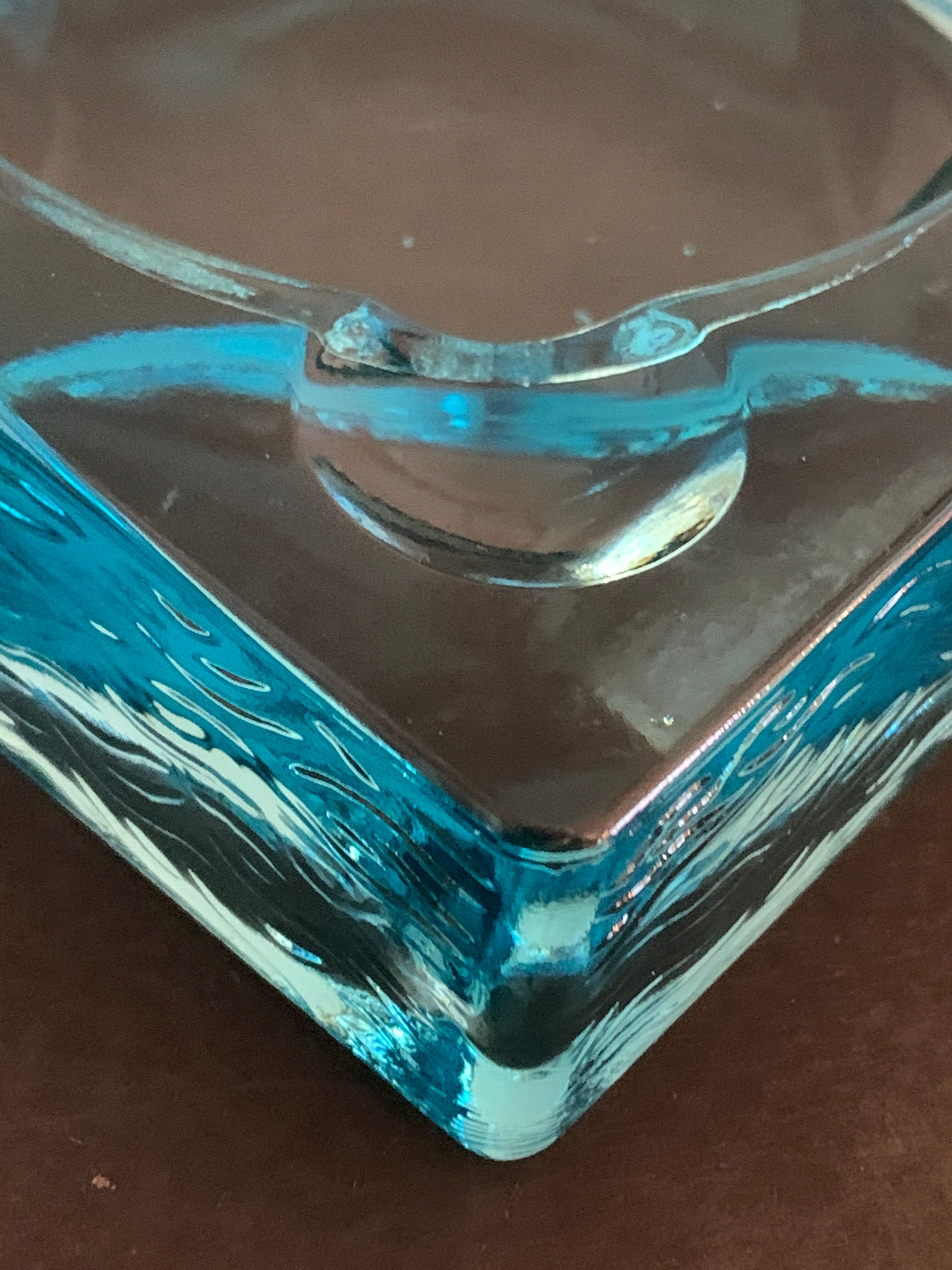 Ashtray paved in blue glass