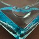 Ashtray paved in blue glass