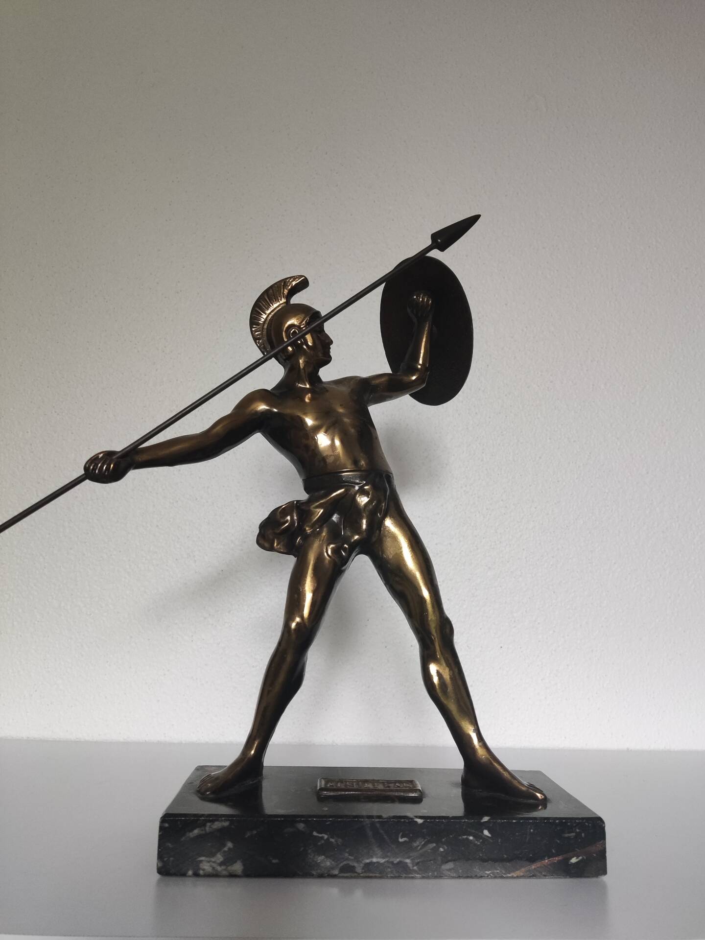 Large statue of Achilles, Greek warrior, marble base, ancient mythology.