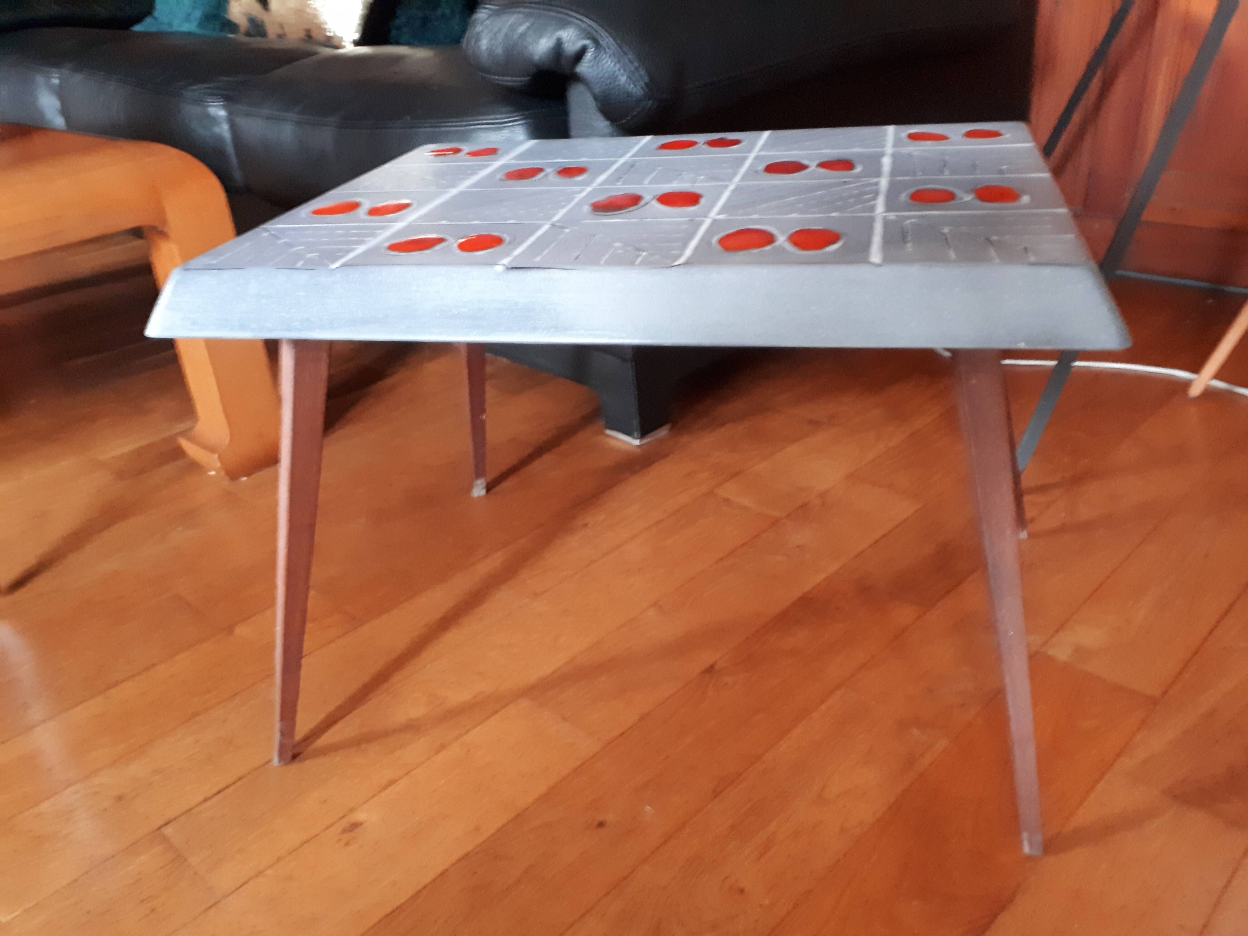 Small 1960s enamelled table, spindle legs, signed jd.