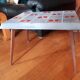 Small 1960s enamelled table, spindle legs, signed jd.