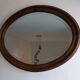 Antique oval beveled mirror