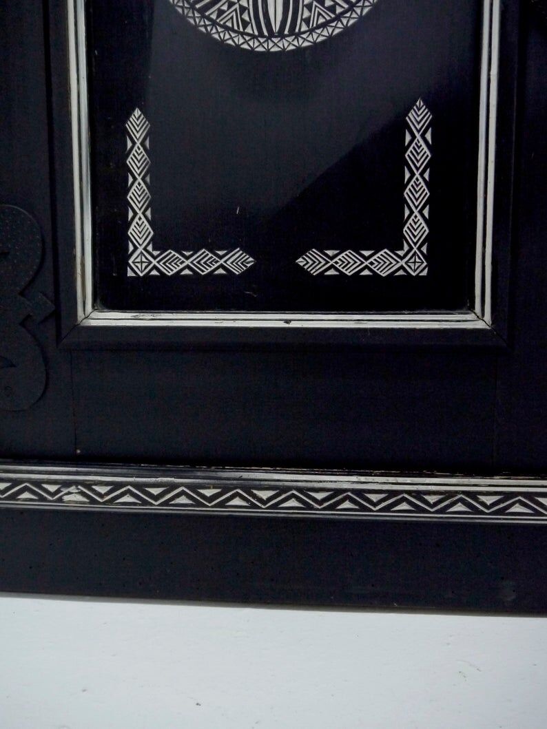 Antique wooden cabinet painted in black and with incised white painted decorations, Ettore Zaccari, Italy c 1910