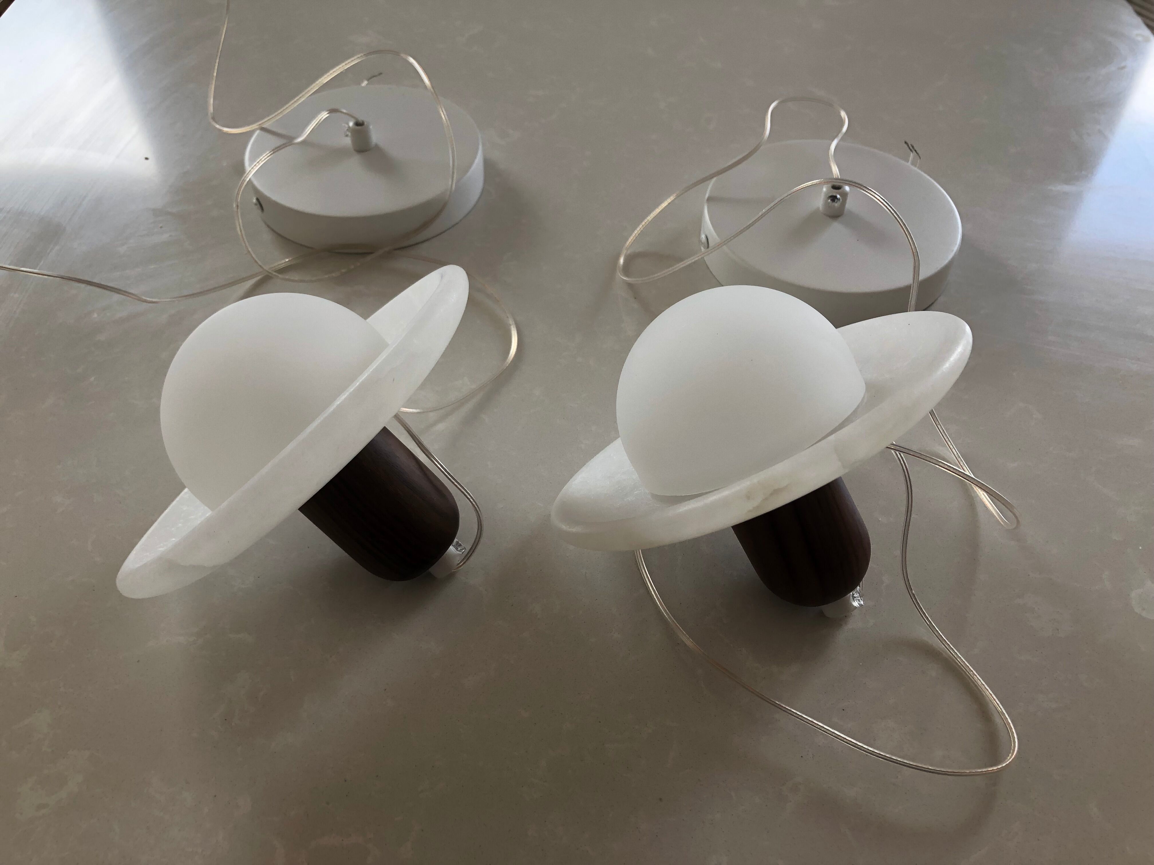 Pair of onyx and walnut suspended light fixtures