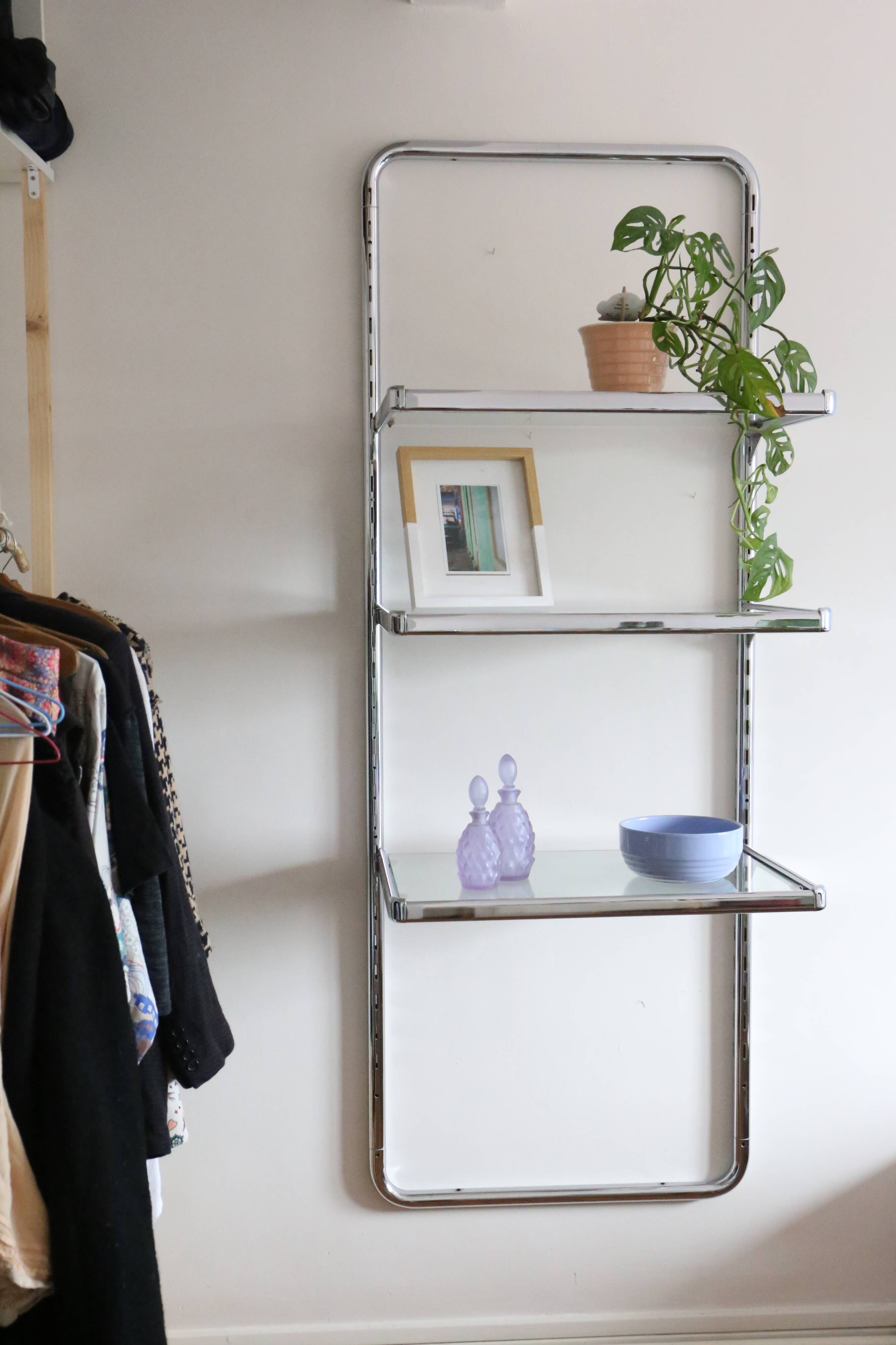 Chrome and glass wall shelf, circa 1960