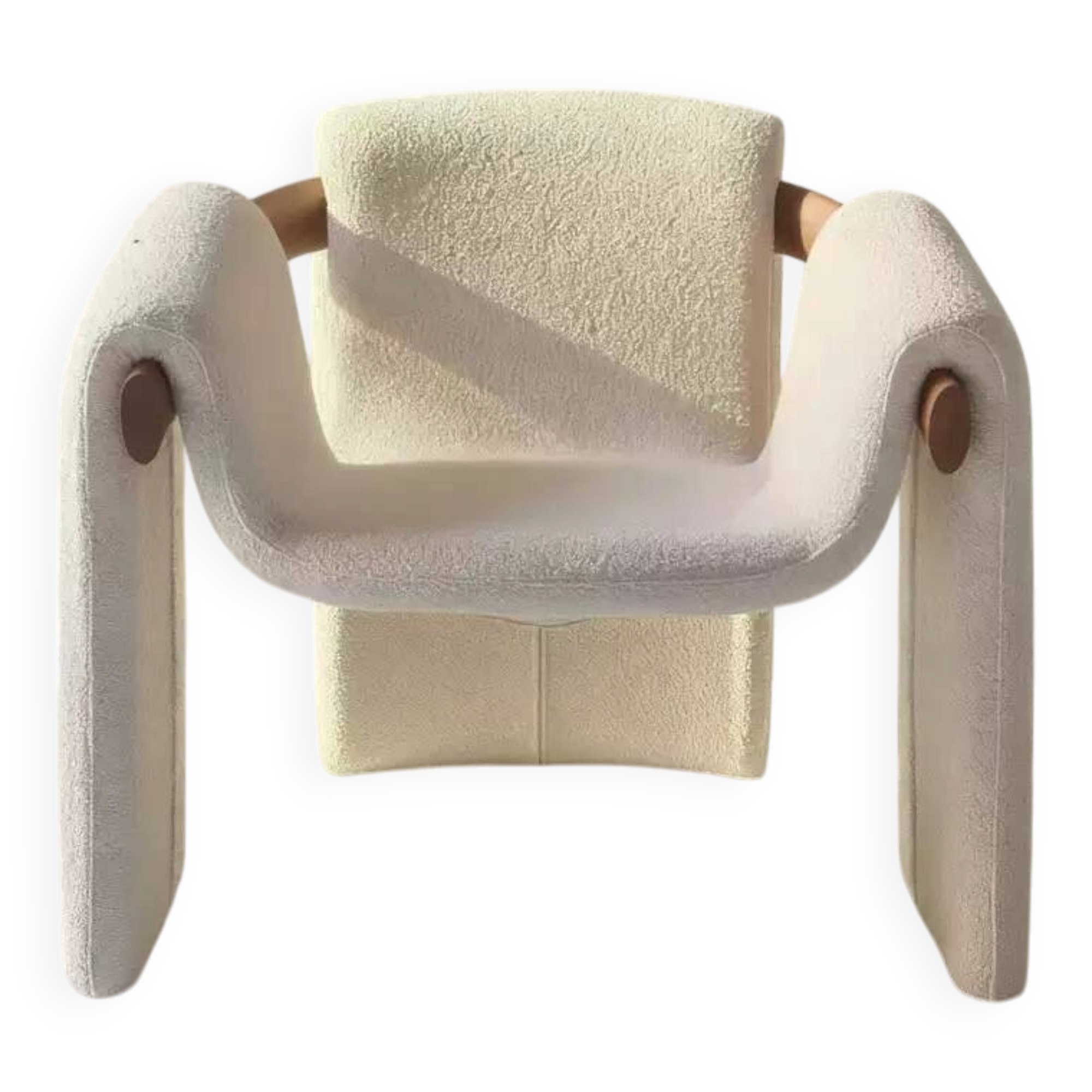 Sculptural lounge armchair in ecru boucle fabric with solid wood details.