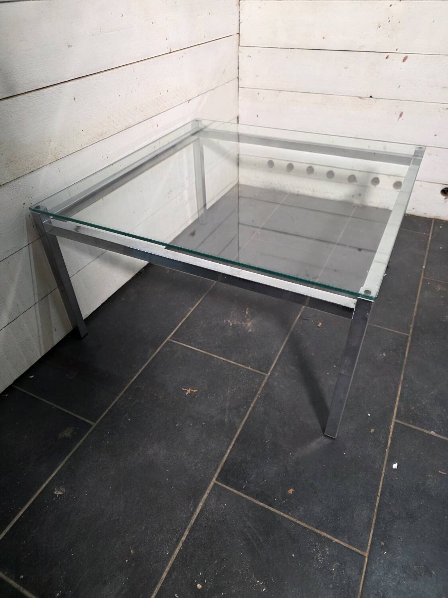 Chrome metal coffee table with a glass top from the 1970s.