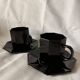 Set of 2 arcoroc black glass coffee cups with underplates