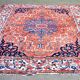 Ancient Persian carpet made of hand-woven wool. Very good condition.