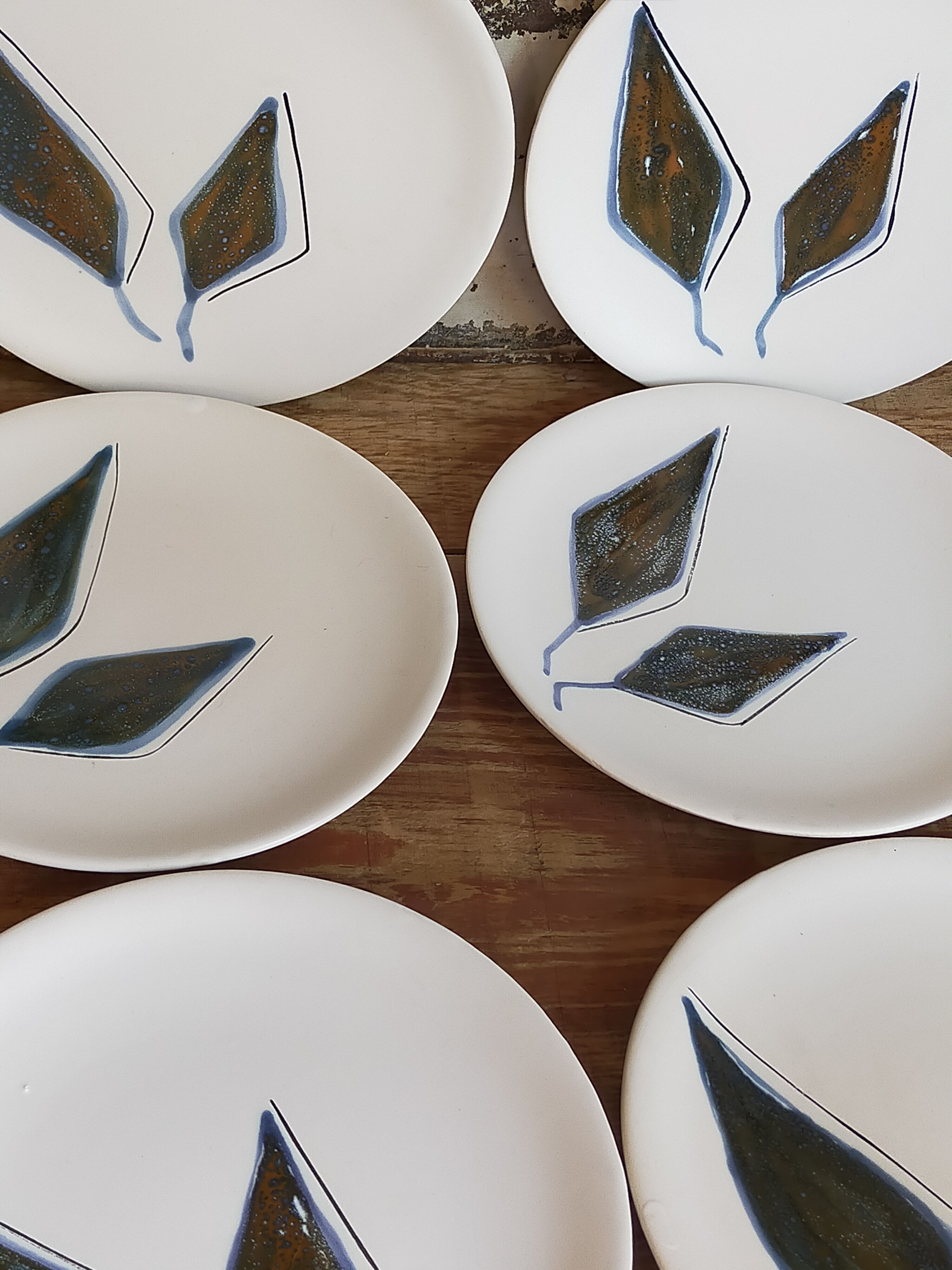 Six ceramic plates with matt enamel 50s