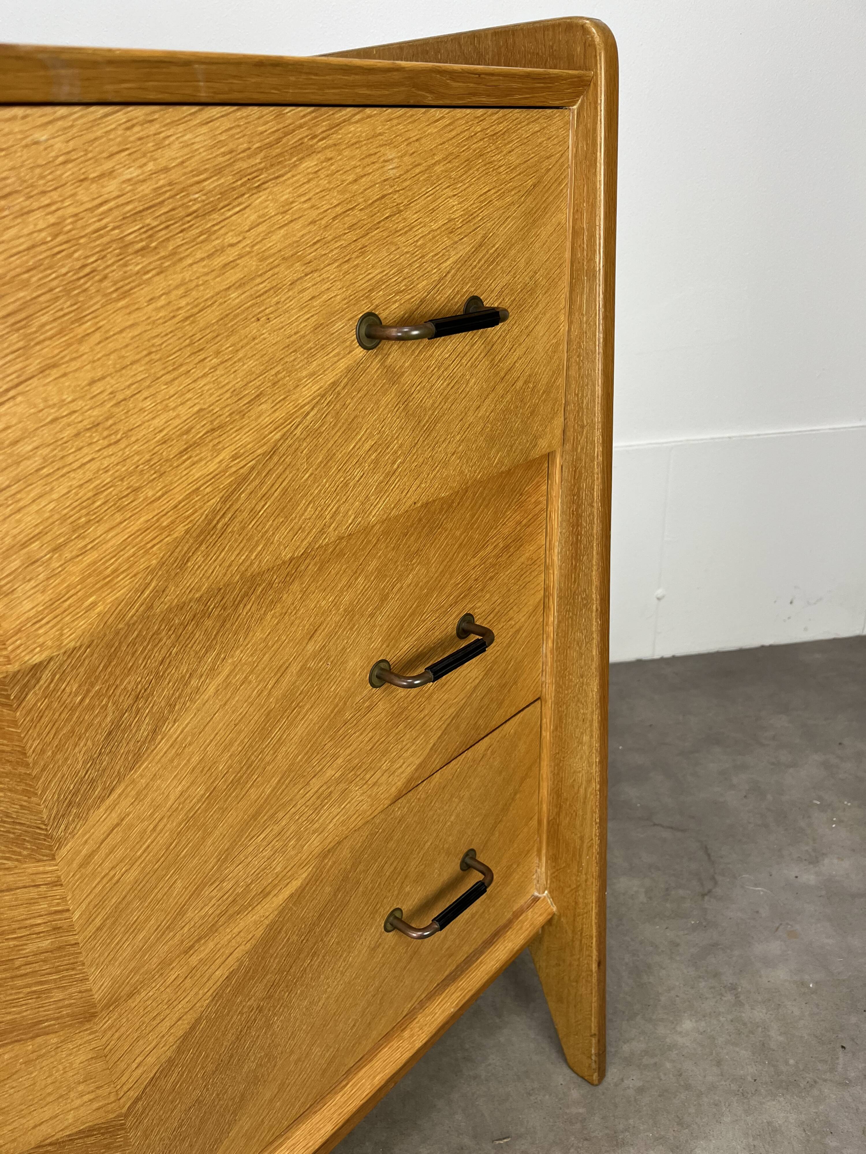 50s chest of drawers with blond wood compass feet