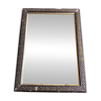 Antique mirror in black and gold wood