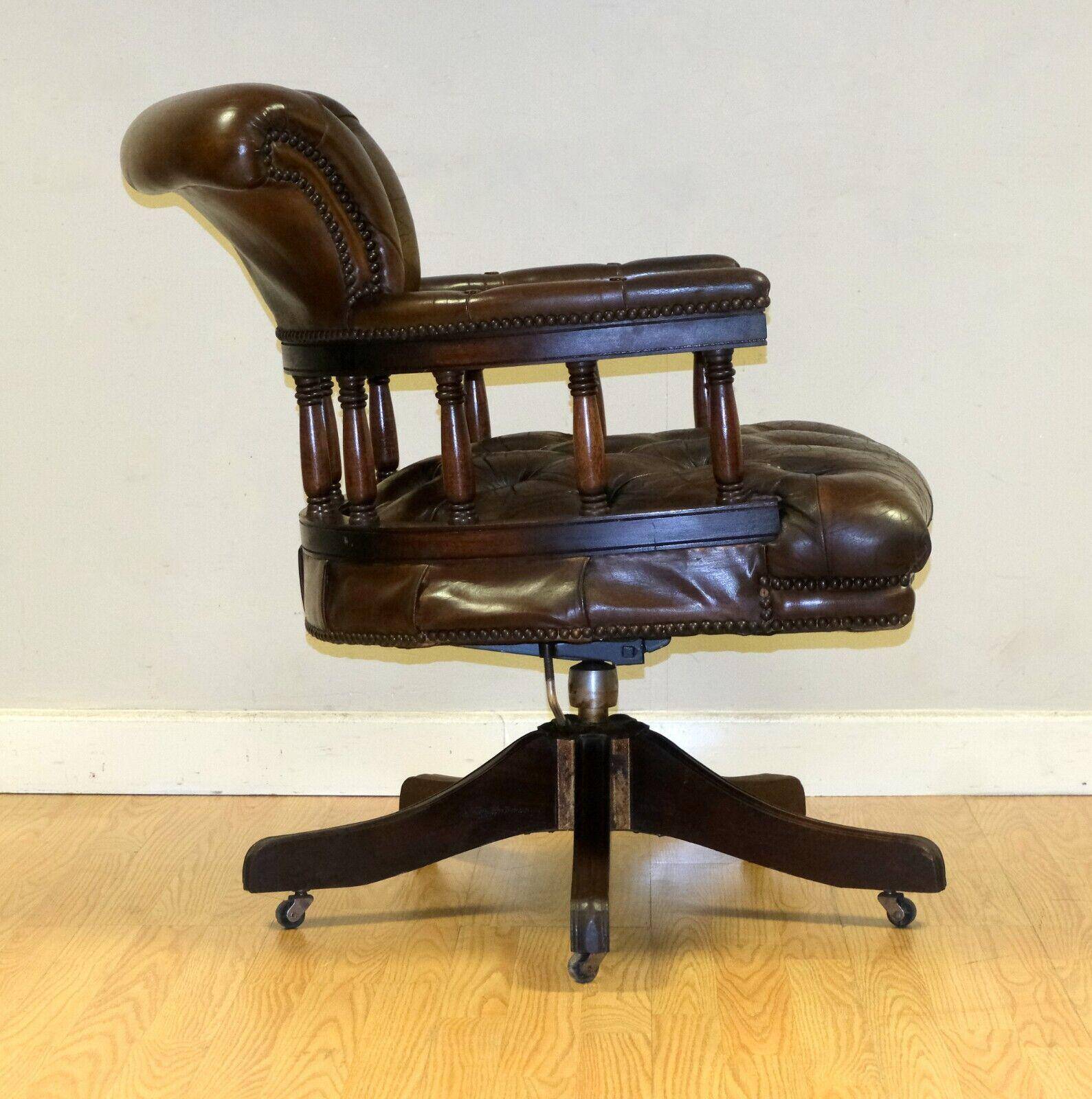 Restored Chesterfield captain's armchair in leather with an oak frame.