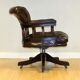 Restored Chesterfield captain's armchair in leather with an oak frame.