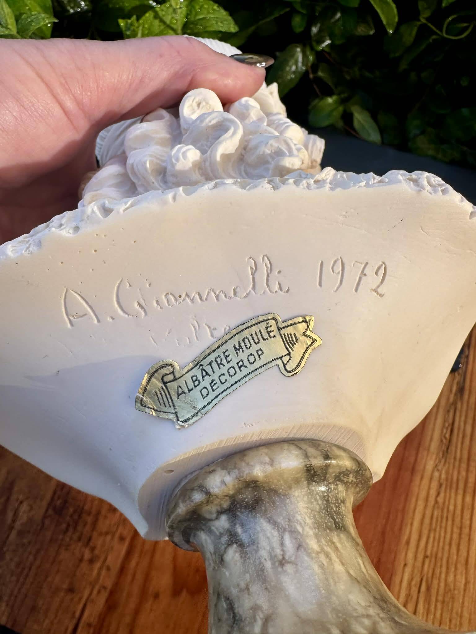 Bust of a woman signed Arnaldo Giannelli dated 1972.