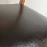 Vintage chair in wood and black leatherette