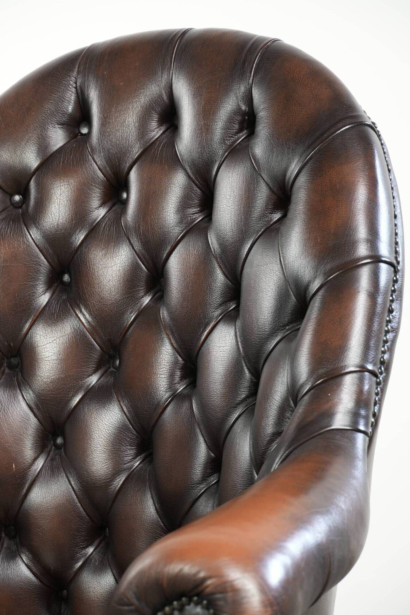 Brown cow leather Chesterfield office chair on wheels in English style