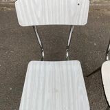 2 beige formica and steel chairs