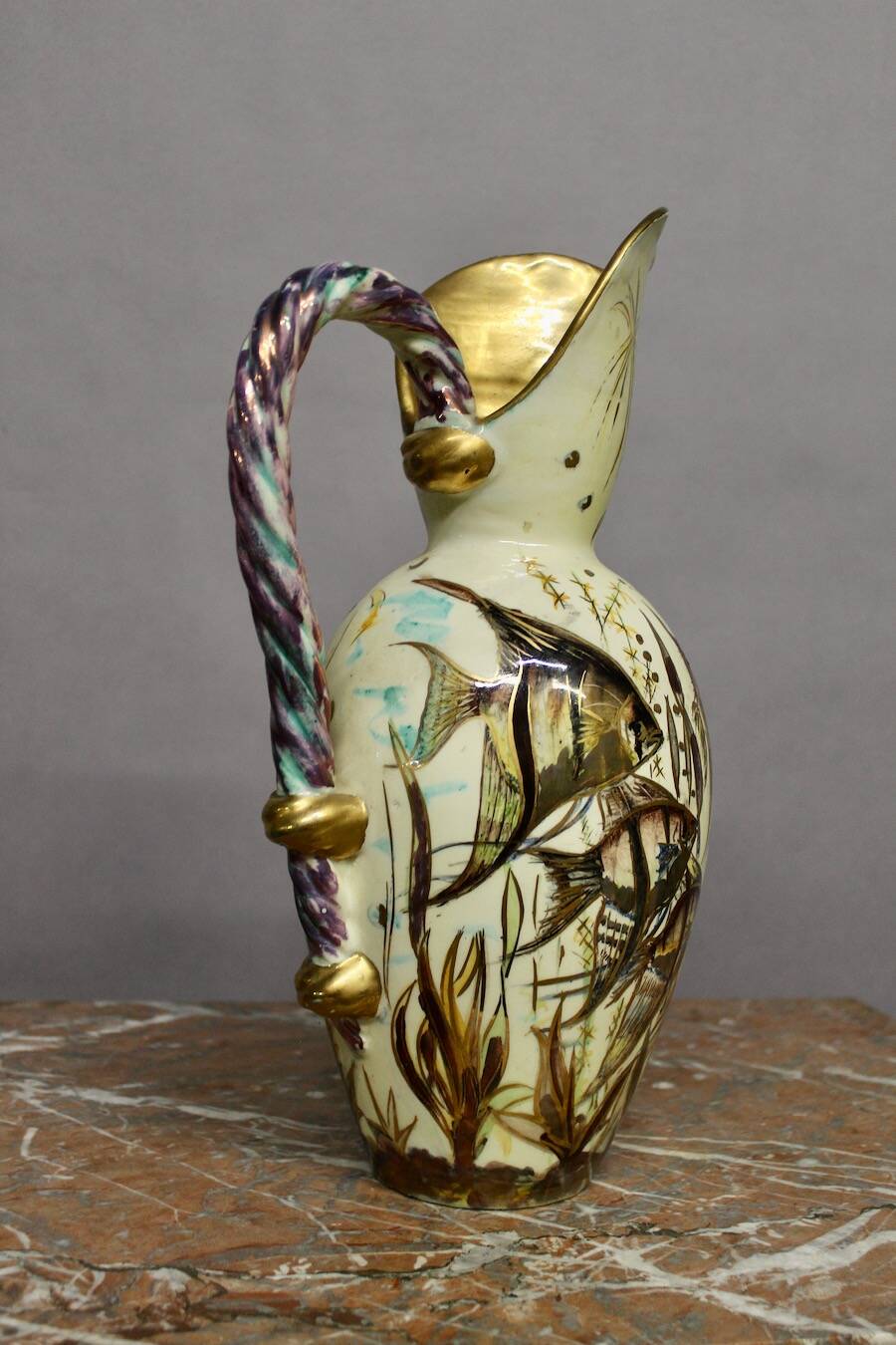 Ceramic jug with fish decoration