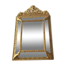 Former mirror beveled to shield closed, in gilded wood, 87 x 54 cm