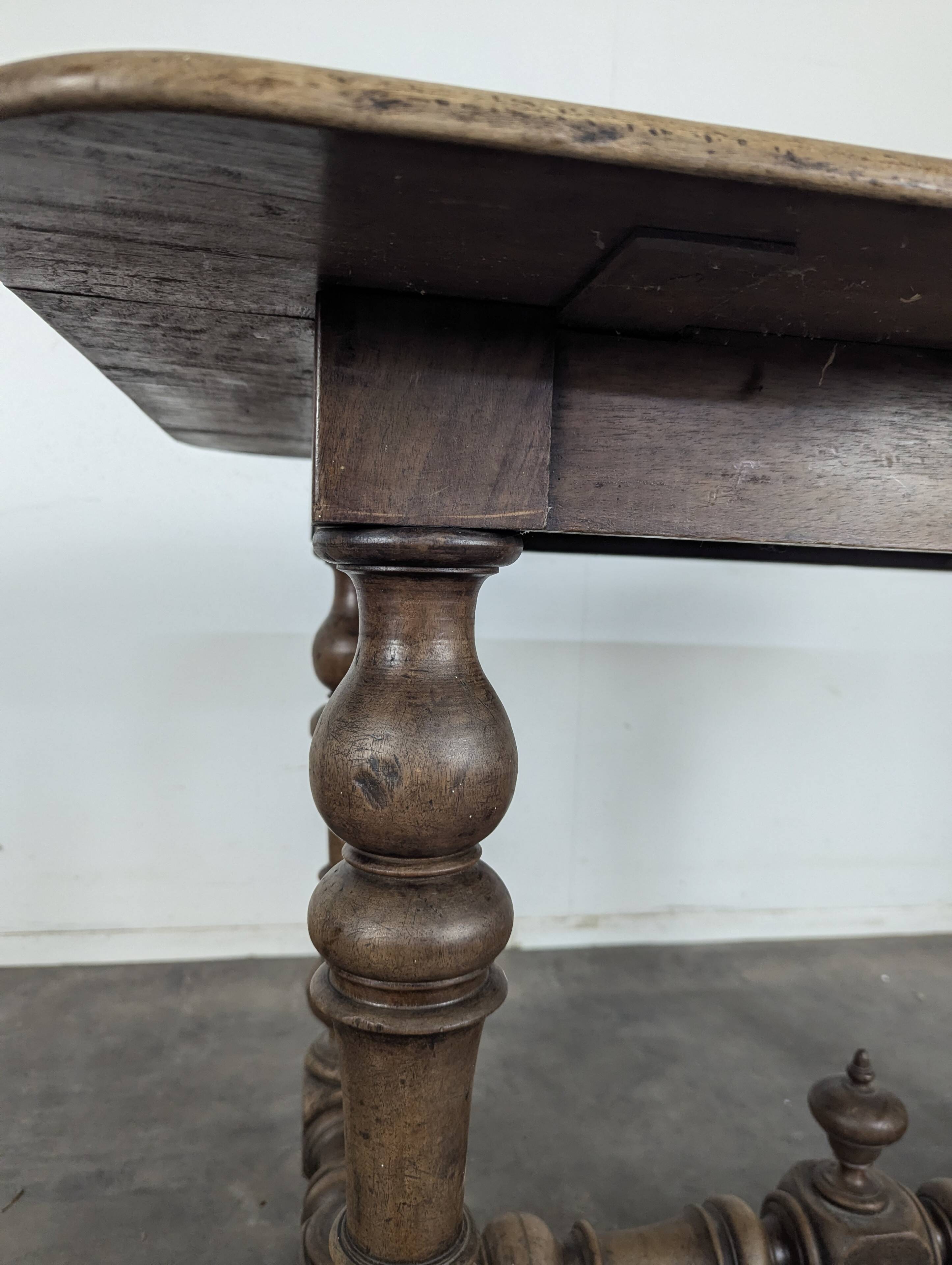 Louis XIII oak table with baluster legs and H stretcher.