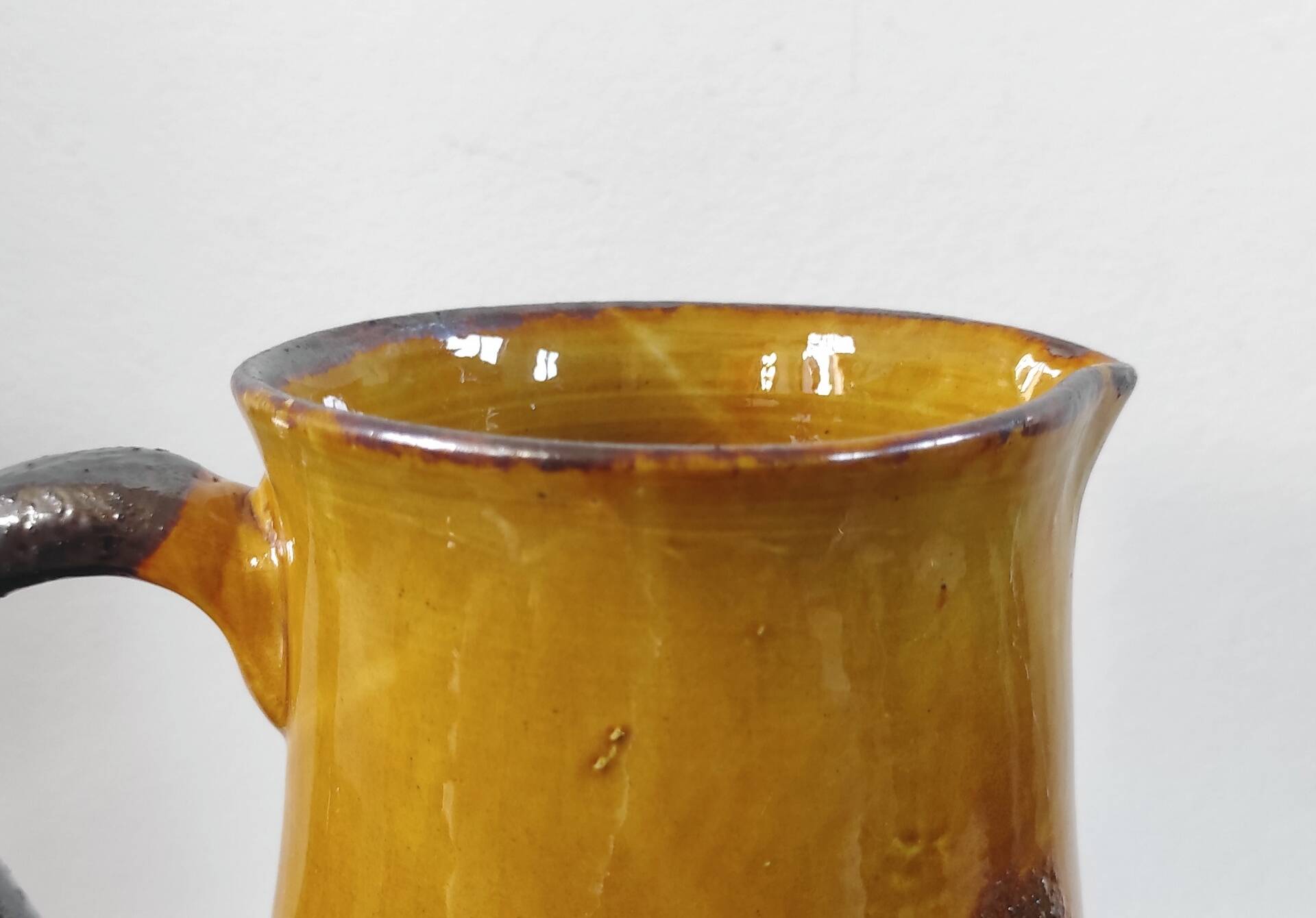 Vintage glazed terracotta pitcher