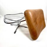 Brown leather ottoman on chrome base
