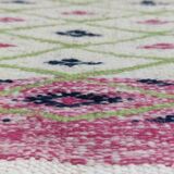 Handmade geometric patterned rug in natural wool