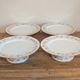 Set of 4 porcelain display cups of the depot rue Drouot in Paris