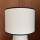Table lamp in ceramic with a handmade couture-style lampshade from France.