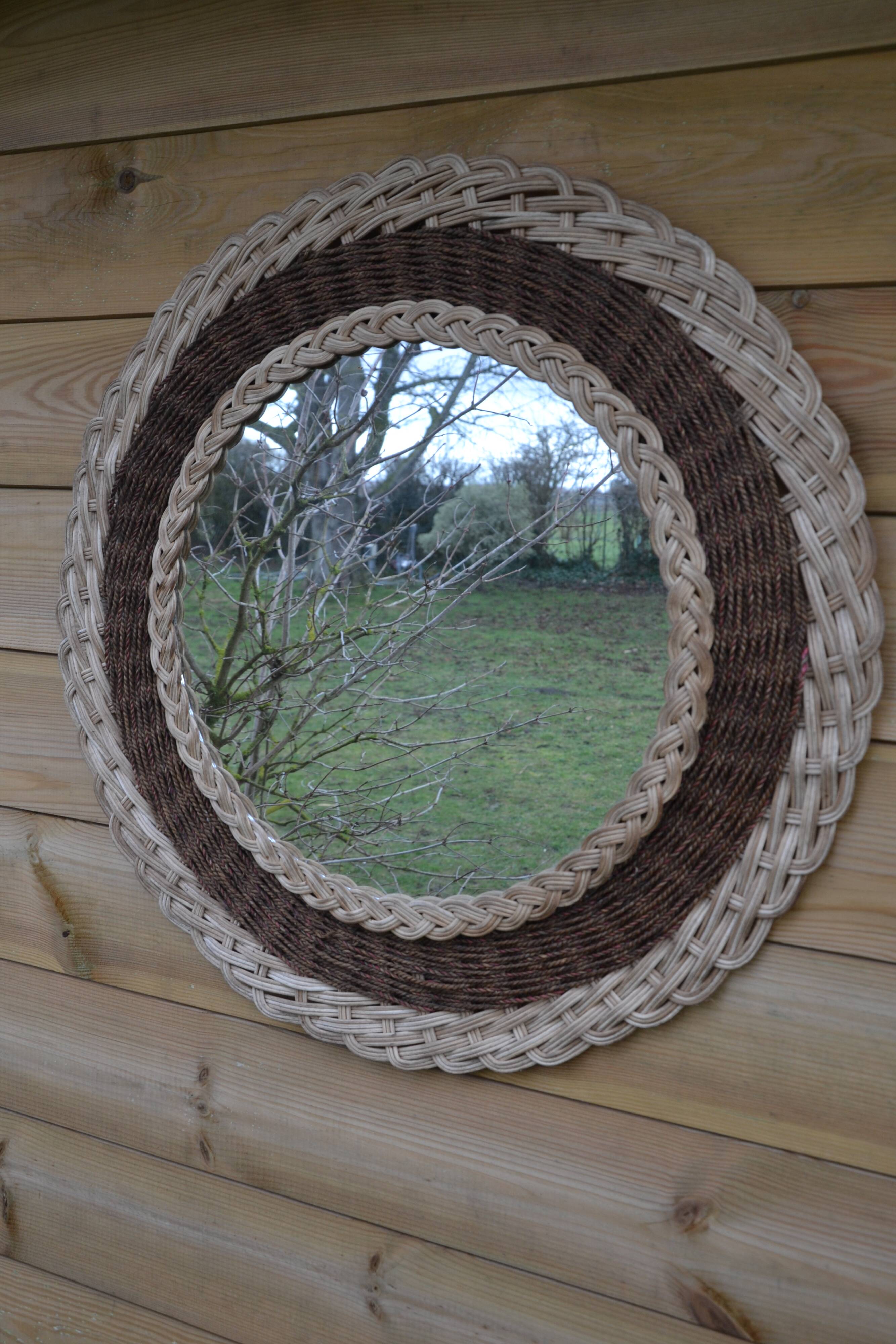 Round woven rattan mirror with rope from the 1970s.
