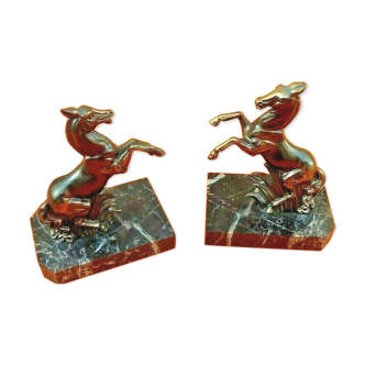 Pair of bookends regulated in the shape of upright horses. mid-20th century in the most