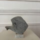 Marble sculpture in the shape of a fish.