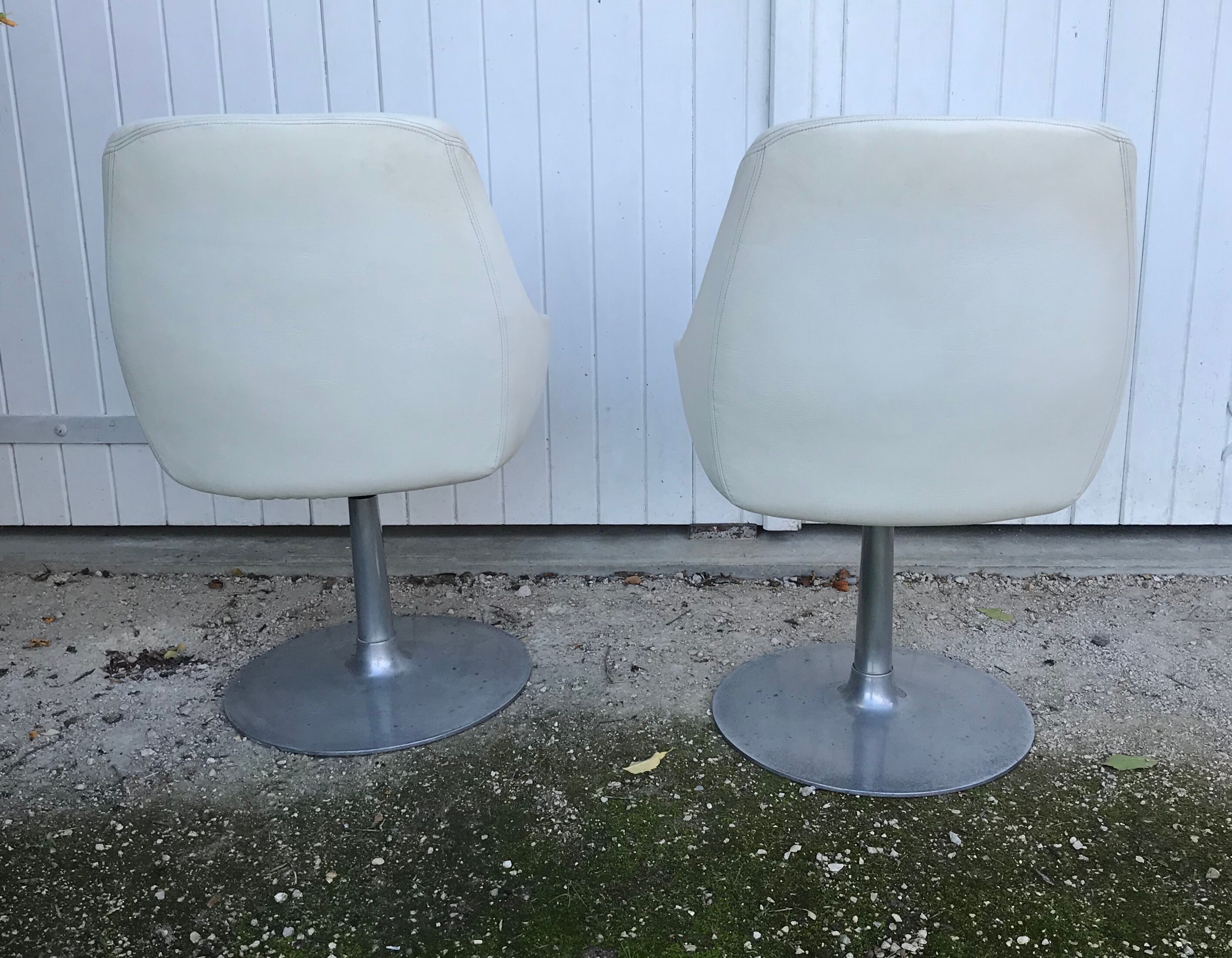Pair of vintage armchairs with swivel tulip feet