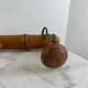 Wooden coat rack with three ball hooks.