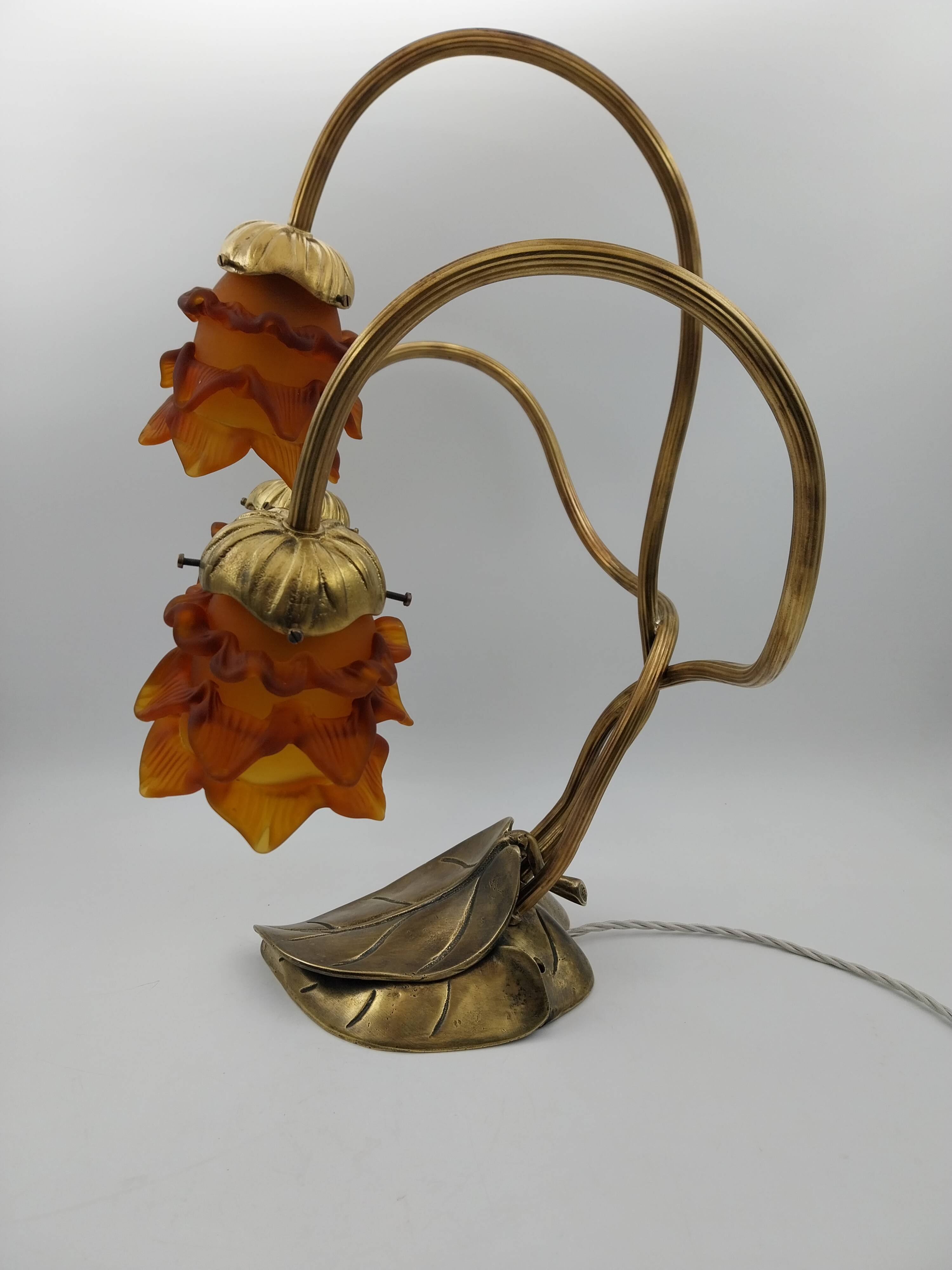 Lamp with brass leaves and glass paste flowers.