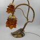 Lamp with brass leaves and glass paste flowers.
