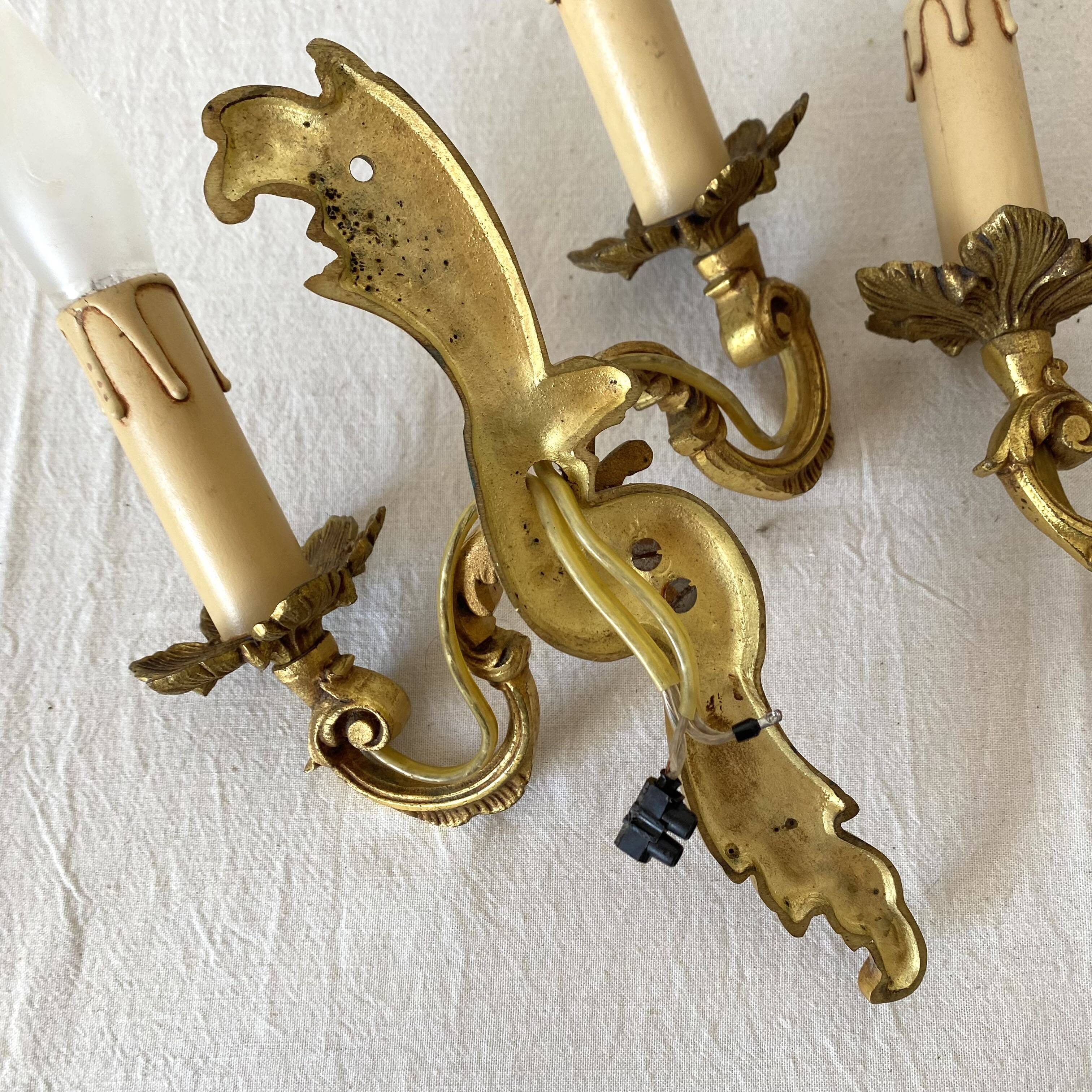 Pair of golden rococo-style wall lights